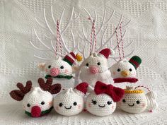 crocheted christmas ornaments with snowmen and reindeer heads