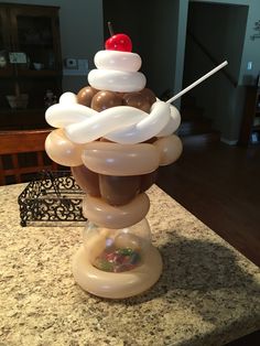 some balloons are stacked on top of each other in the middle of a kitchen counter