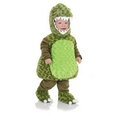 a toddler in a green dinosaur costume