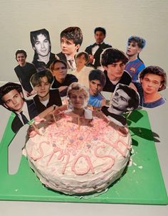 a birthday cake with pictures of the famous actors on it and candles in front of it