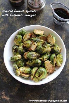 roasted brussel sprouts with balsamic vinegar in a white bowl