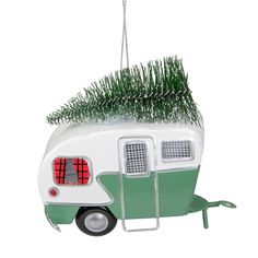 a green and white camper ornament hanging from a chain on a white background