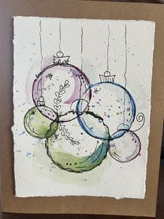 a card with some ornaments hanging from it