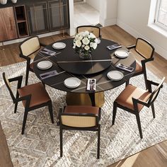 a dining room table with chairs around it