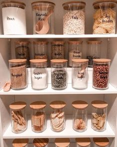 the shelves are filled with different types of spices