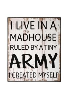 a wooden sign that says i live in a madhouse, rules by tiny army