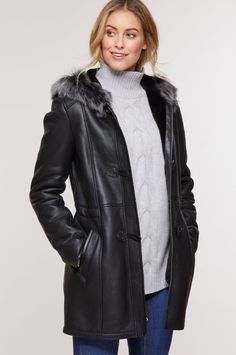 Women's Fur Sheepskin Parka Leather Coat In Black Indulge in luxury with our women's fur sheepskin parka leather coat. Crafted from real sheepskin with a semi-aniline finish, it features a cozy faux shearling inner, a hooded fur collar, and a practical button closure. The open hem cuffs, two side pockets, and a sleek black color add both style and functionality to this chic winter essential. Outer Shell: Real Leather Leather Type: Sheepskin Leather Finish: Semi-aniline Inner Shell: Faux Shearling Feature: Hooded Fur Collar Closure Style: Button Collar Style: Hooded Cuffs Style: Open Hem Inside Pockets: One Outside Pockets: Two Side Pocket Color: Black Black Sheepskin Leather Jacket With Faux Fur Trim, Elegant Shearling Outerwear, Black Leather Fur Coat With Faux Fur Trim, Classic Sheepskin Coat With Faux Fur Trim, Classic Sheepskin Fur Coat With Faux Fur Trim, Elegant Black Sheepskin Fur Coat, Luxury Black Sheepskin Fur Coat, Black Sheepskin Long Coat, Elegant Leather Fur Coat For Winter