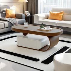 a living room with two couches and a coffee table in the middle of it