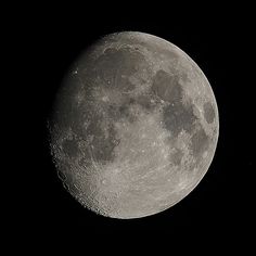 the full moon is shown in black and white