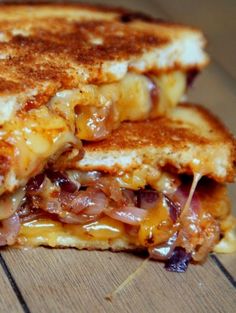 a grilled cheese and bacon sandwich on a wooden table