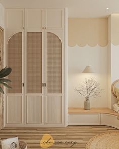 a bedroom with white walls and wooden flooring next to a plant in a vase