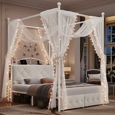 a white canopy bed with lights around it