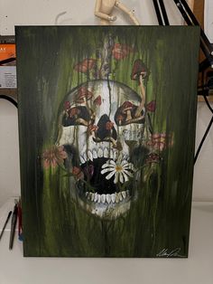 a painting of a skull with mushrooms on it