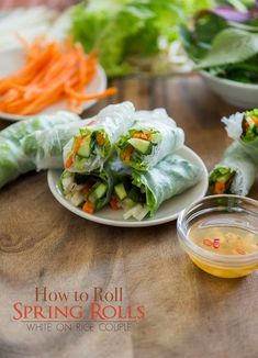 spring rolls with carrots, cucumber and lettuce on a plate