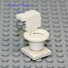 a white toilet sitting on top of a lego base