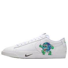 a white shoe with an image of a turtle on the side and green lettering that says,