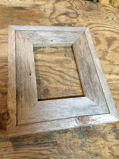 a wooden frame sitting on top of a table