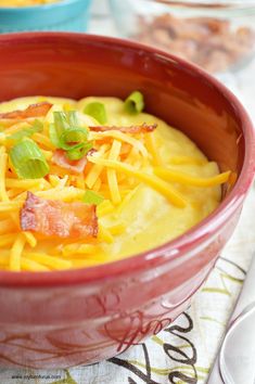 crockpot cheesy potato soup in a red bowl