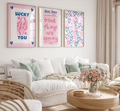 a living room with wicker furniture and pictures on the wall above it's couch