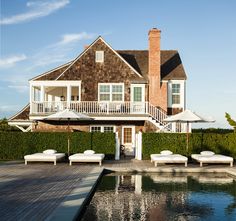 a large house sitting next to a swimming pool