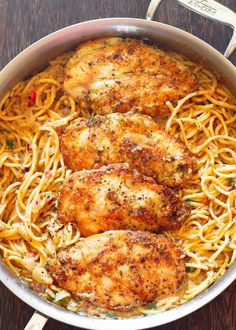 some chicken and noodles in a pan on a table