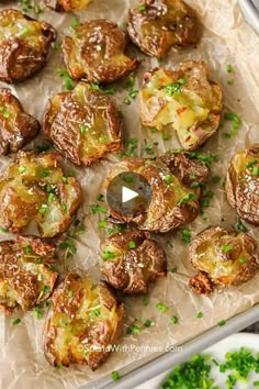 an image of baked potatoes with parsley on the side