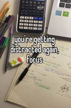 there is a calculator, pencils and paper on the desk with words you're getting distracted again focus