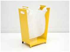 a plastic bag is sitting on top of a yellow stand