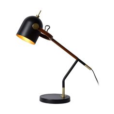 a black and gold desk lamp with a wooden arm on a metal base, the light is dimming