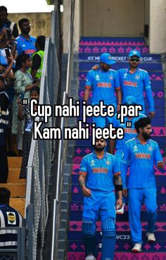 two men in blue uniforms are walking up some stairs with the words cup nahi iece