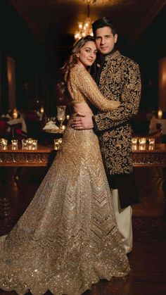 a man and woman dressed in formal wear posing for a photo at their wedding reception