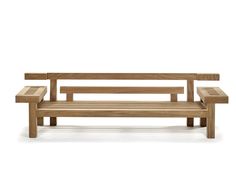 a wooden bench sitting on top of a white floor