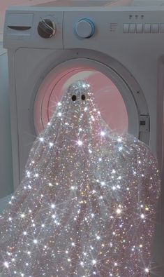 an image of a ghost in front of a washing machine with sparkling clothes on it