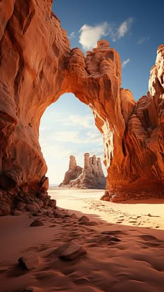 an arch shaped rock formation in the desert