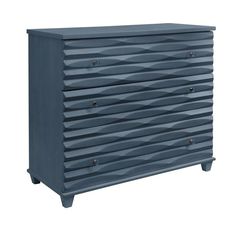 an image of a chest of drawers that is painted in blue and has wavy lines on it