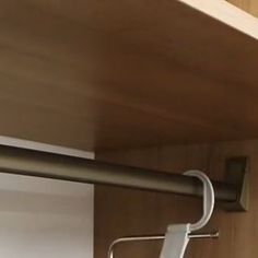 a close up of a metal handle on a shelf