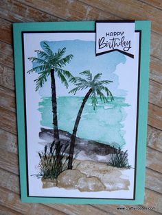 a handmade birthday card with palm trees on the beach