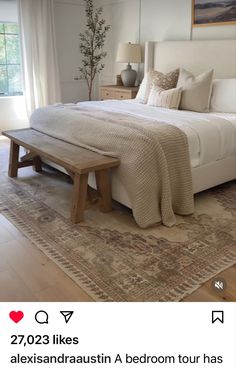 a bedroom with a bed and rug on the floor