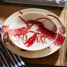 two plates with red lobster designs on them