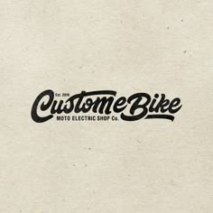 a close up of a logo on a piece of paper with the words custom bike