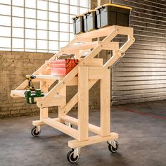 a wooden cart with some containers on it