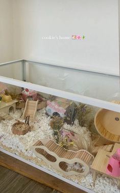 a room filled with lots of fake animals and toys in it's display case