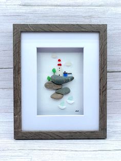 a white frame with a small lighthouse in it