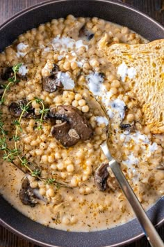 a bowl filled with soup and topped with bread