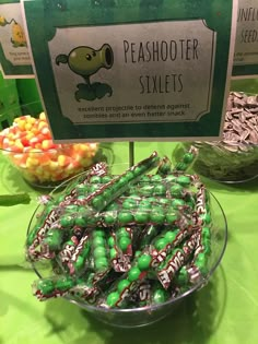 a bowl full of candy sitting on top of a table