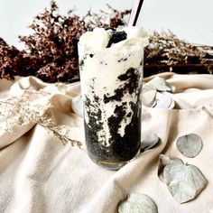 a drink with ice cream and oreo cookies in it