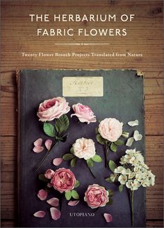 a book with flowers on it and the title, the herbum of fabric flowers