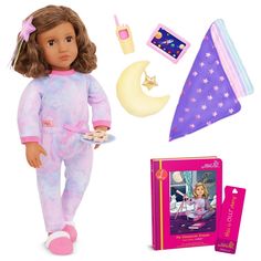 the doll is wearing pajamas and holding a plate with food on it, next to its packaging