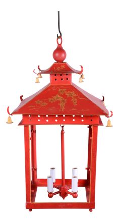 a red lantern with bells hanging from it's side