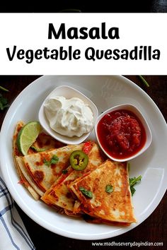 a white plate topped with quesadillas and salsa